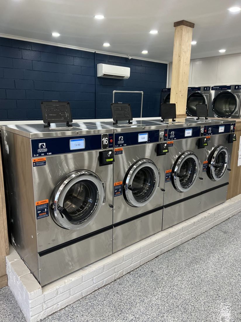 Row of new Dexter washers in the renovated laundromat